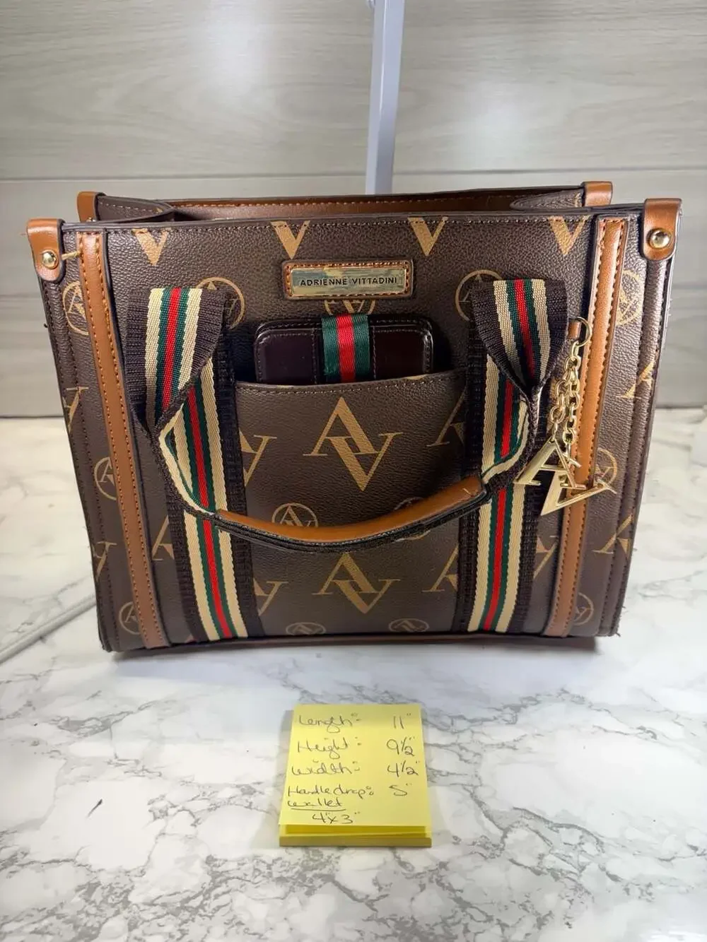 Adrienne Vittadini brown satchel handbag featuring an 